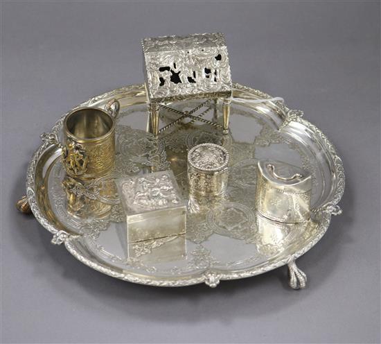 An early 20th century continental white metal miniature bureau, two white metal pill boxes and two plated items.